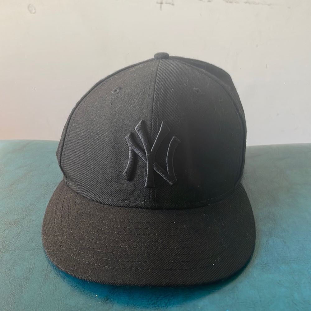New Era Fitted black on black Yankee hat.